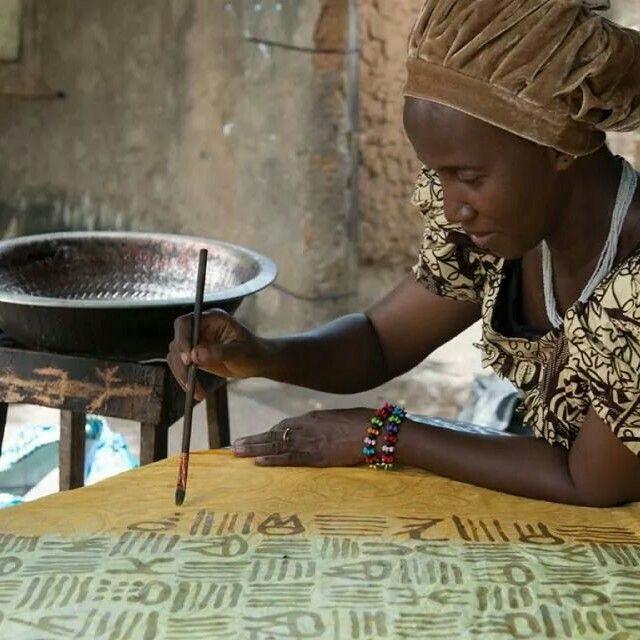 Hand-painting a resist pattern onto cloth