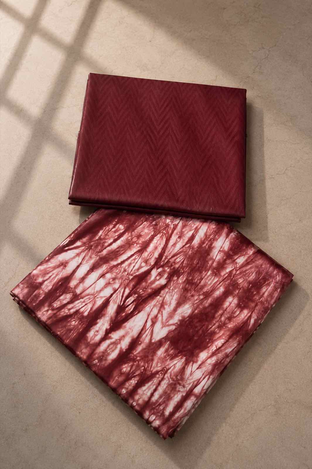 A Rini design, burgundy with a chevron weave